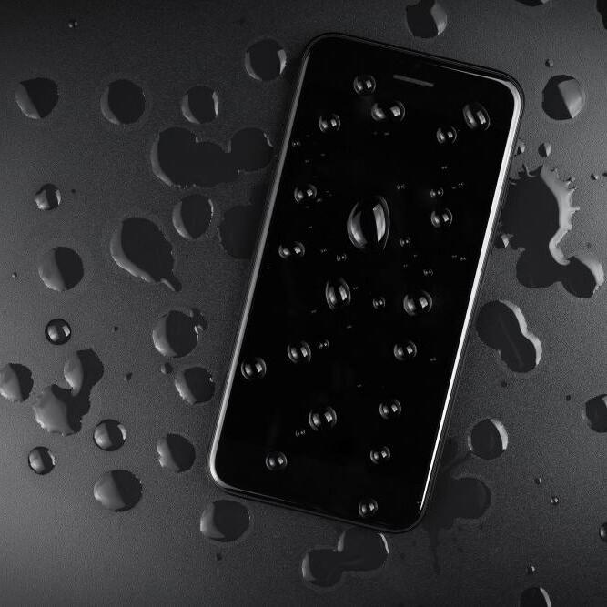 An iPhone with water droplets on the screen.